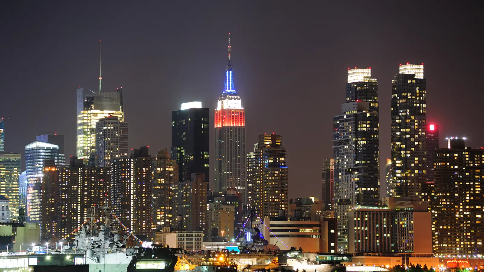 Midtown Manhattan skyline lit up at night.